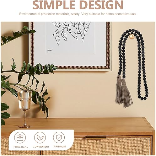 Artibetter Guirlande de Perles de Bois Noires de Style Rustique avec Pompons - 1,45 m - Nail Gallerys