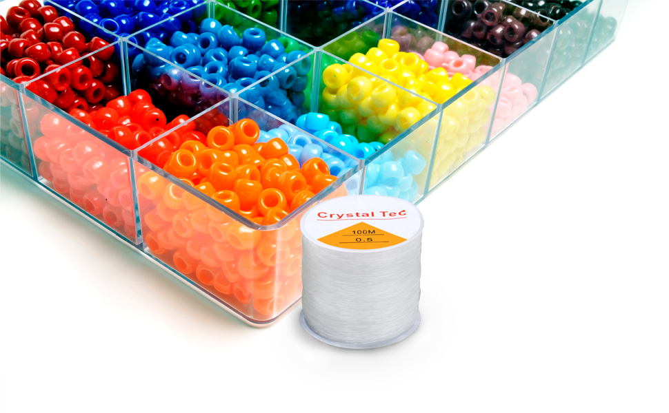 TRIXES Clear Spool on a table with multicoloured beads for jewellery making and arts and crafts