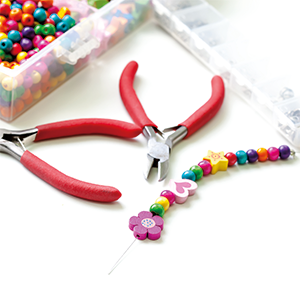 TRIXES Clear Spool used for beading and jewellery making on a craft table